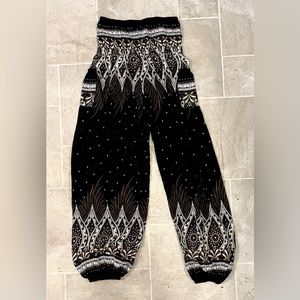 Black, tan and white baggy/yoga pants. Size small.